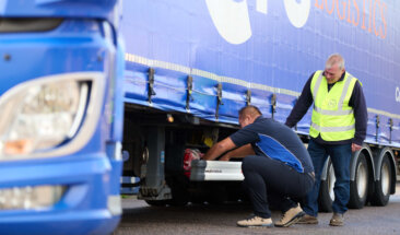 Driver checking truck