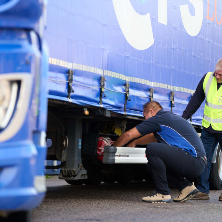 Driver checking truck