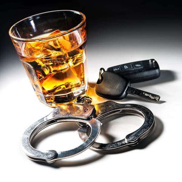 Drink driving glass of whisky car keys and handcuffs