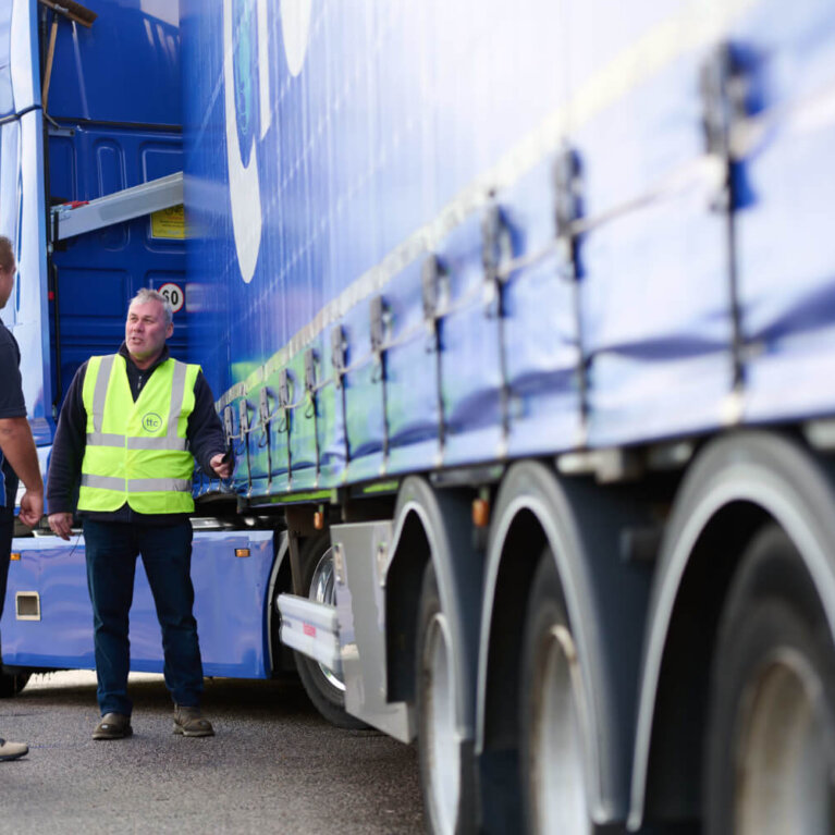 Driver checking truck